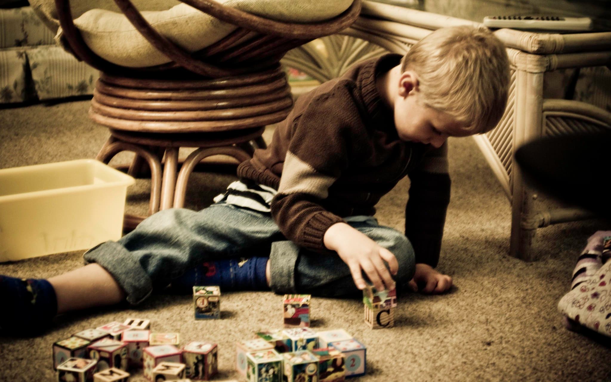 child playing with building blocks